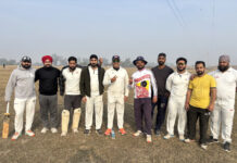 Players posing for group photograph during a match.
