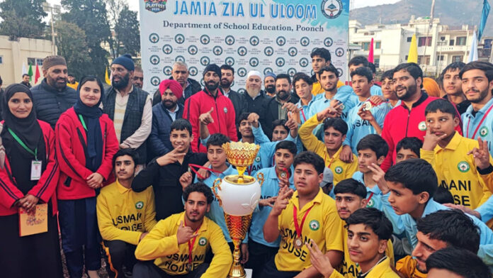 Young athletes posing along with trophy and dignitaries in Poonch.
