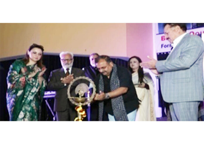 Dignitaries lighting traditional lamp during a programme. Dignitaries lighting traditional lamp during a programme.