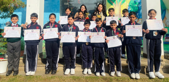 Medal winners posing along with medals and certificates.