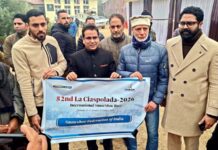 MLA Zadibal Tanvir Sadiq flagging off Muzamil Hussain Mir of Srinagar for international snowshoe running event in Italy.