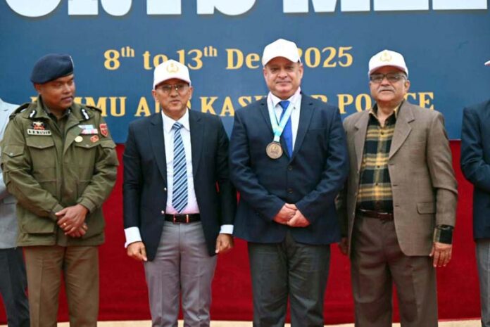 Senior J&K Police officers posing with winner of a sports event during Inter-Zone Sports Meet. Senior J&K Police officers posing with winner of a sports event during Inter-Zone Sports Meet.