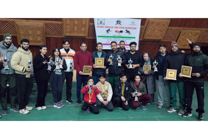 Winners posing along with dignitaries during an event.