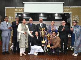 Winning team posing along with dignitaries during prize distribution ceremony.