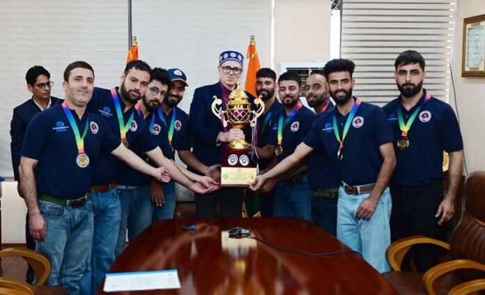 CM Omar Abdullah posing along with J&K Deaf Cricket team and trophy. CM Omar Abdullah posing along with J&K Deaf Cricket team and trophy.