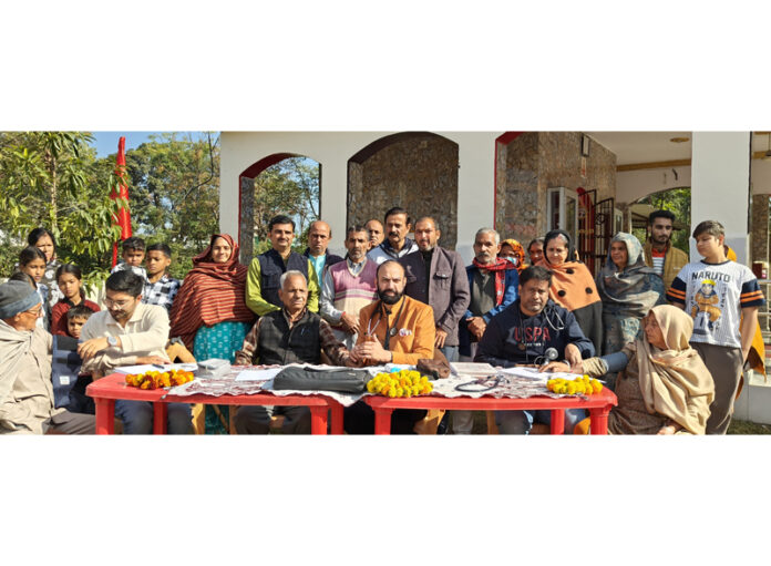 HoD Cardiology GMC & SSH Jammu Dr Sushil Sharma examining patients.