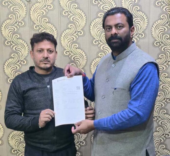 Keshav Chopra distributing ration card during a camp in Jammu. Keshav Chopra distributing ration card during a camp in Jammu.
