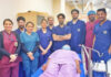 A team of doctors posing with a patient on whom they performed advanced cardiac procedure at AIIMS Jammu.