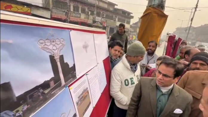 NC's chief spokesperson, Tanvir Sadiq lying foundation stone for illuminated landmark at Alamgari Bazar in Srinagar.