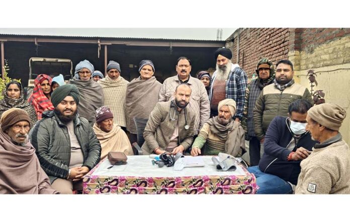 HoD Cardiology GMC & SSH Jammu Dr Sushil Sharma examining patients at Suchetgarh on Sunday.