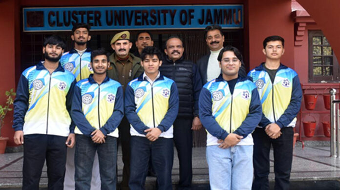 Men's Badminton team posing along with dignitaries.