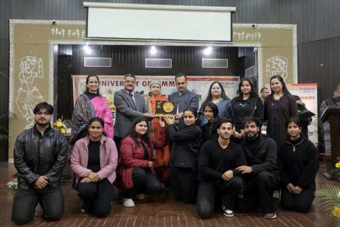Winners receiving memento from dignitaries during a programme.