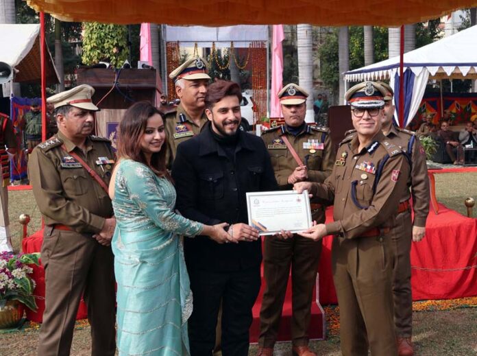 DG Home Guards, Civil Defence and SDRF A. G. Mir felicitating Civil Defence Volunteers during 63rd Annual Raising Day in Jammu on Saturday.(UNI) DG Home Guards, Civil Defence and SDRF A. G. Mir felicitating Civil Defence Volunteers during 63rd Annual Raising Day in Jammu on Saturday.(UNI)