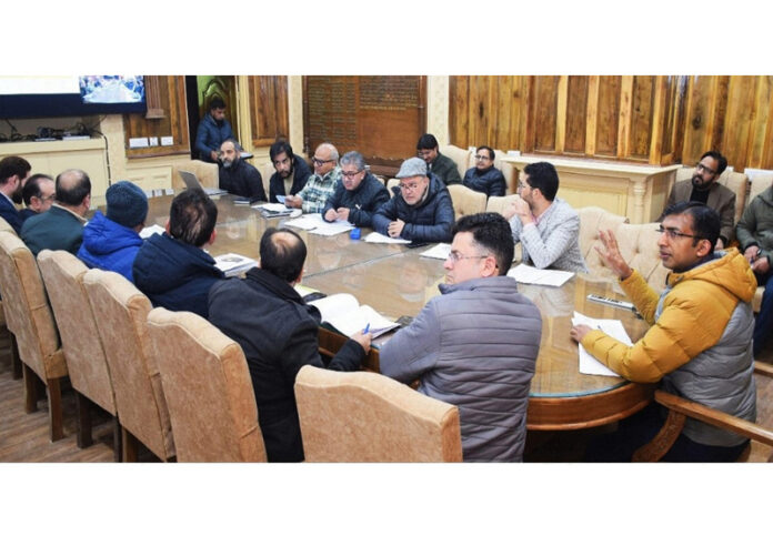 Div Com Kashmir Anshul Garg chairing a meeting at Srinagar on Friday.
