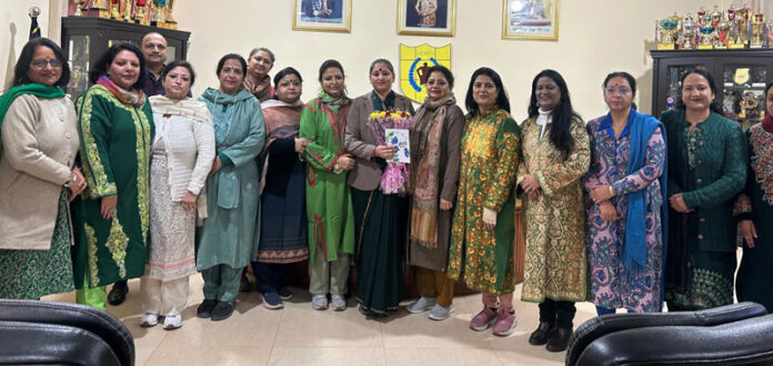 Staff members posing along with newly appointed Principal Sonia Anand.