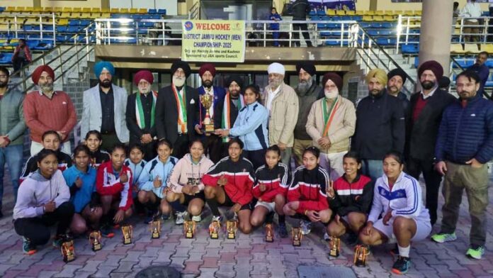 Winning team, posing along with trophy.