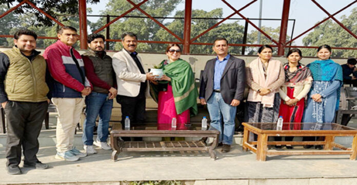 Management presenting plant to chief guest Dr. Twinkle Suri during a programme.
