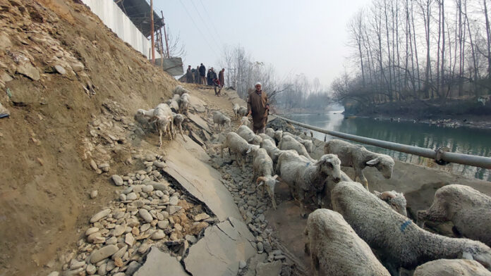 A view of collapsed road at Pethkundal in Shalbug area of central Kashmir’s Ganderbal district. -Excelsior/ Firdous Ahmad.