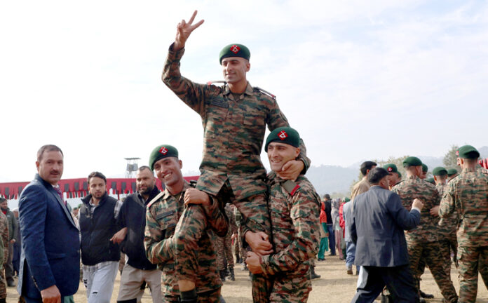 Newly recruited Indian Army personnel celebrating after the passing-out parade at the JAKLI Regimental Training Centre, Dhansal in Udhampur on Monday.(UNI)