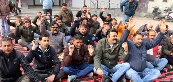 PHE employees staging protest dharna in Jammu. — Excelsior/Rakesh