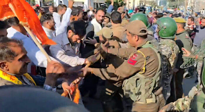 Protesters being stopped by Policemen during demonstration outside SMVD Shrine Board office at Katra on Monday.