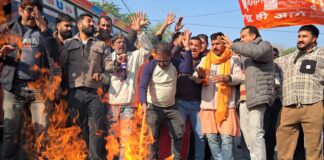 Rashtriya Bajrang Dal activists torching an effigy during protest at Jammu on Thursday. -Excelsior/Rakesh