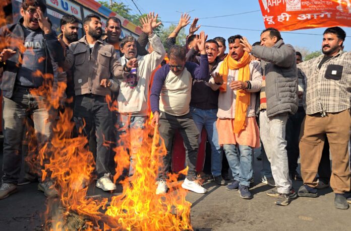 Rashtriya Bajrang Dal activists torching an effigy during protest at Jammu on Thursday. -Excelsior/Rakesh