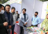 Agri Minister Javid Ahmad Dar interacting with staff and others during function in Jammu.