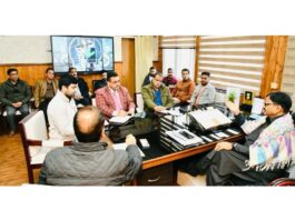 Minister Javed Rana chairing a meeting at Jammu on Tuesday.