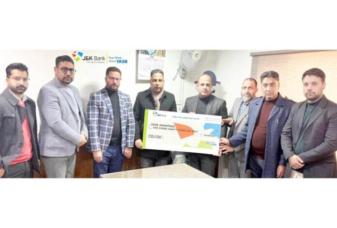 Dignitaries from J&K Bank presenting a cheque to a beneficiary in Anantang district on Tuesday.