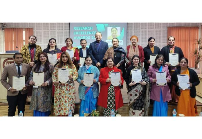 Faculty members posing with their certificates during Research Excellence Awards Ceremony 2024–25 at MIER College of Education.