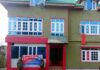Police personnel pasting orders of attachment outside a residential property in Bijbehara area of Anantnag district on Friday.