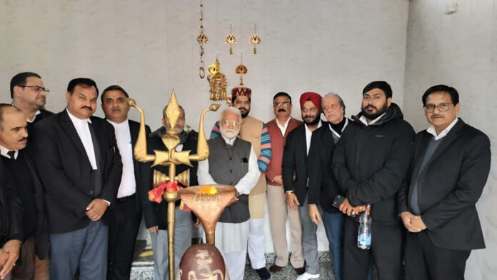 Sangharsh Samiti team and BAJ office bearers offering prayers at Shiv Mandir within the premises of High Court complex in Jammu on Tuesday.