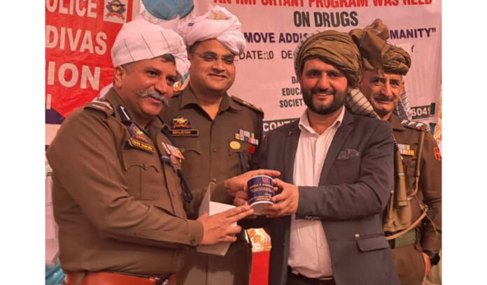 DIG JSK Range Shiv Kumar Sharma being presented with a souvenir during a programme at Janaka Dansal Village in Nagrota on Wednesday.
