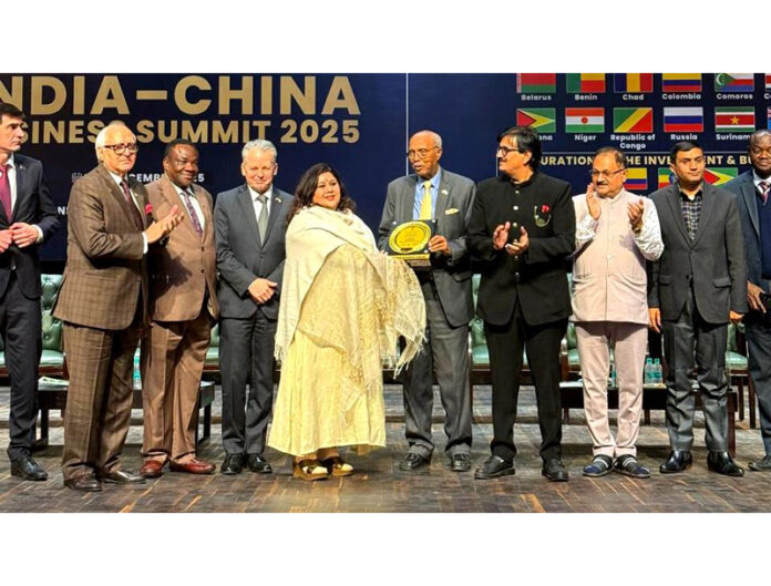 Sufi singer, Ragini Rainu receiving an award during a function in New Delhi.