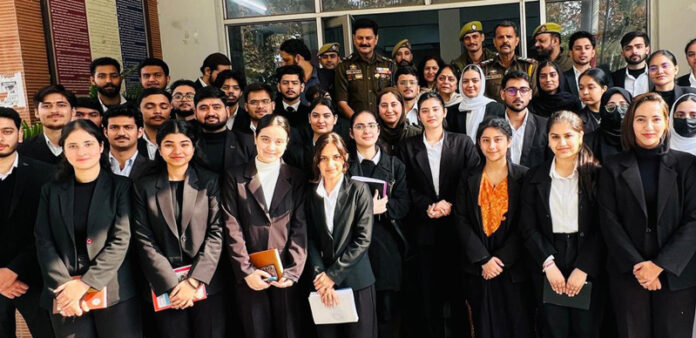 JU Law School students with the SHO and SDPO during their visit to Gandhinagar Police Station.