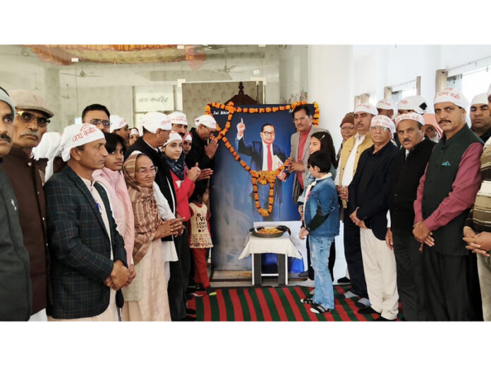 Followers of Dr B R Ambedkar paying tribute to the late leader on his 69th Mahaparinirwan Divas in Jammu.