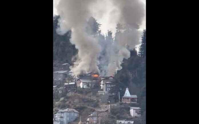 Flames erupting from residential area in Puneja village of Bhaderwah on Wednesday. —Excelsior/Tilak Raj