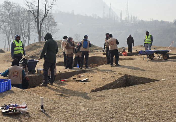 Researchers and archaeologists examining ancient remains at the Zehanpora excavation site in Baramulla. —Excelsior/Aabid Nabi