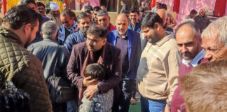 Minister Satish Sharma during visit to Chamb constituency on Thursday.