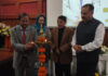 Dignitaries lighting the traditional lamp during a function in Jammu.