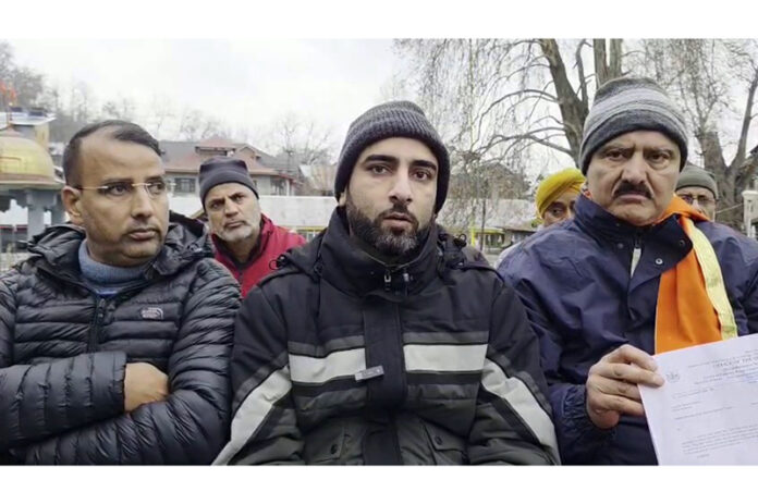 Scientists from SKUAST along with president, Martand Tirath Trust talking to reporters at Mattan on Tuesday.
