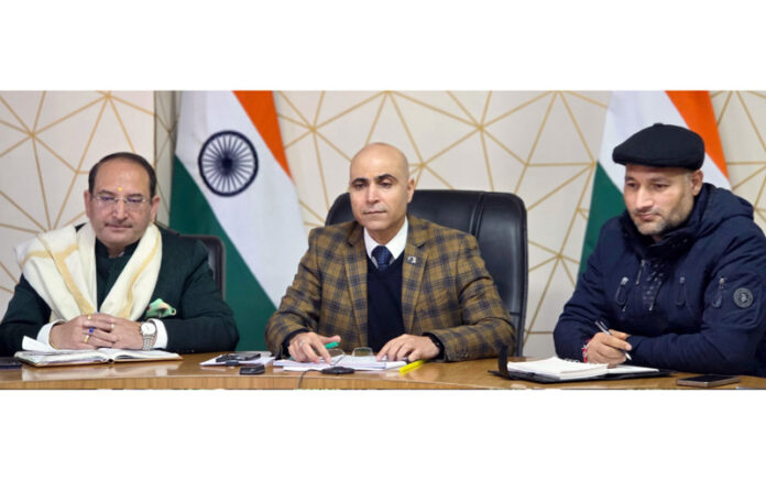 DC Kishtwar chairing a meeting on Friday.