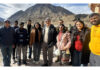 LG Ladakh Kavinder Gupta posing with tourists at Sangam Point in Leh.