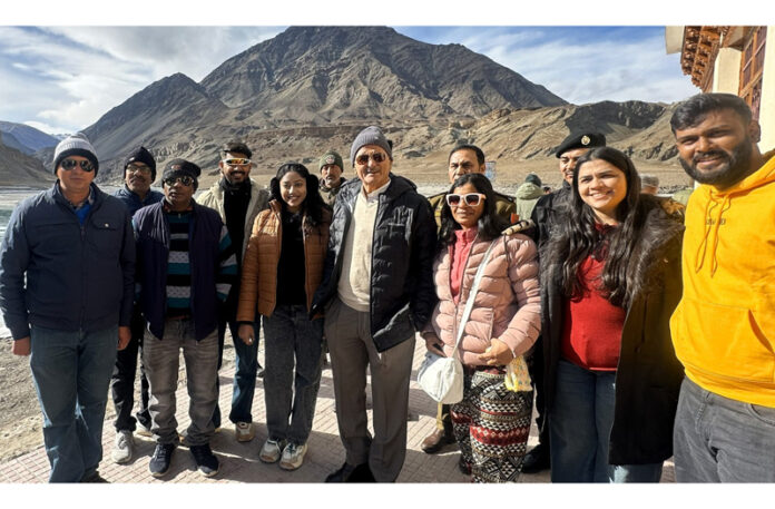 LG Ladakh Kavinder Gupta posing with tourists at Sangam Point in Leh.