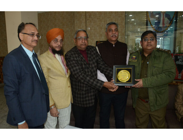 Members of Shri Guru Ravidass Sabha presenting a memento to Amit Bhasin, SSP Traffic during a function in Jammu.
