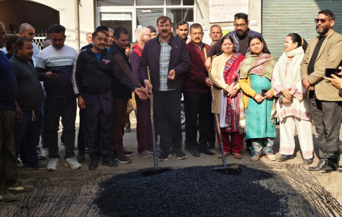 MLA Jammu West, Arvind Gupta kick starting the black topping of roads in Ward Number 32 and 39 on Friday. MLA Jammu West, Arvind Gupta kick starting the black topping of roads in Ward Number 32 and 39 on Friday.