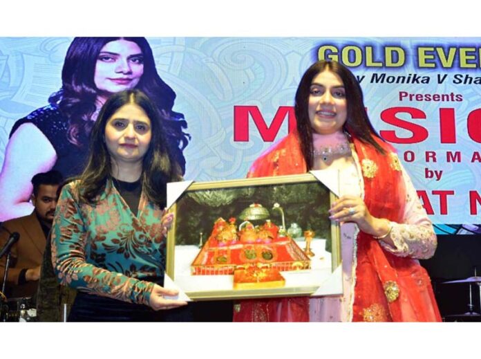 Monica Sharma presenting a memento to Mannat Noor during an event in Jammu.