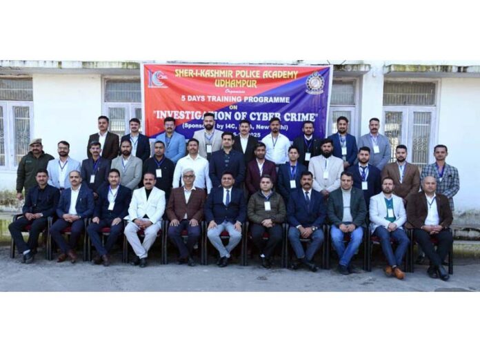 Rajinder Kumar Gupta posing for a group photograph along with the trainee police officers at SKPA Udhampur.
