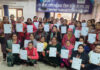 Women trainees posing with their certificates during valedictory function of a training programme at SBI-RSETI, Jammu.